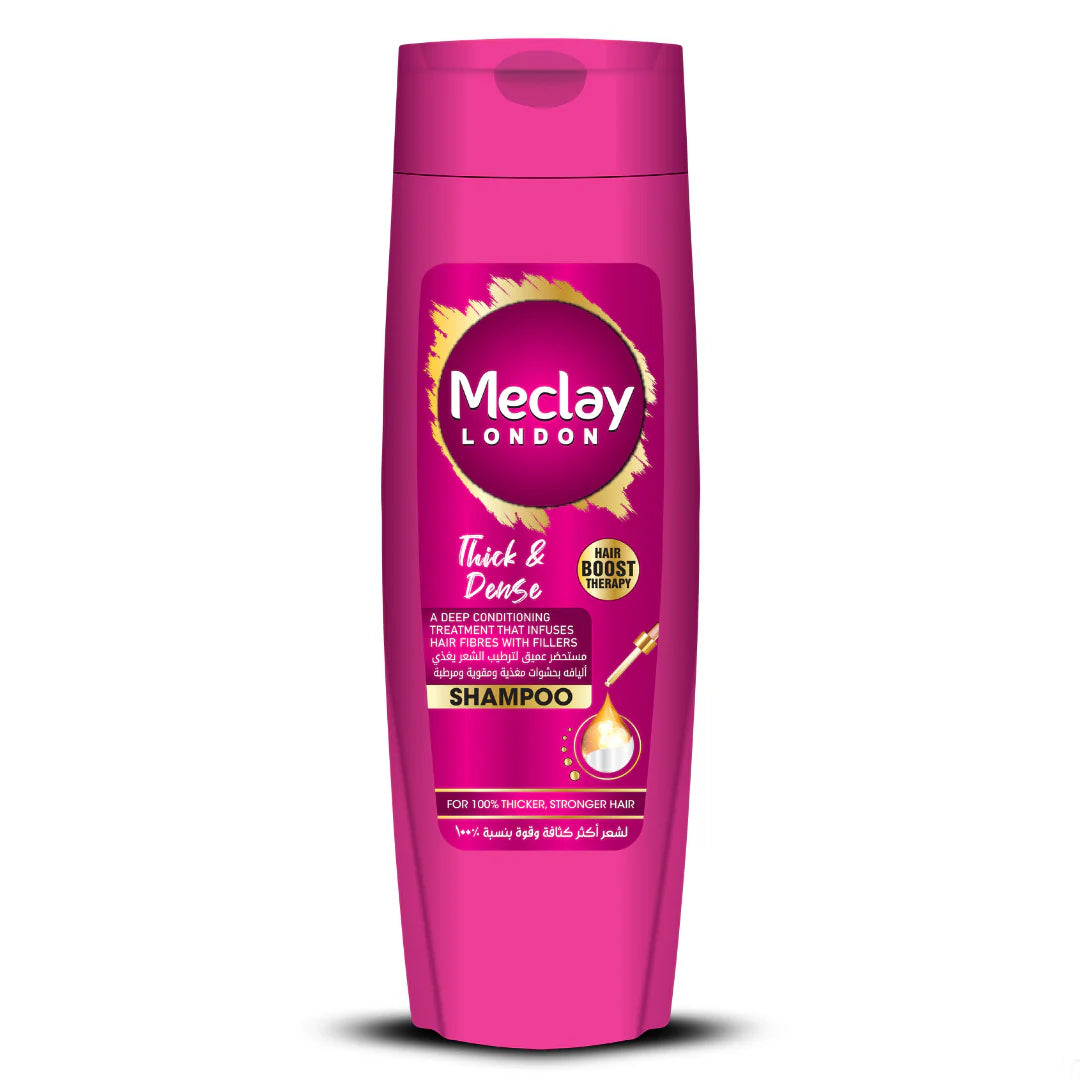 Pink shampoo bottle with Meclay London label on a white background